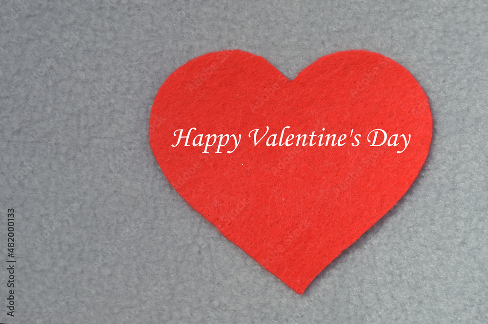 Happy Valentine's Day. background for the design of a romantic holiday. Love. Red felt heart. Happy Valentine's Day. background for the design of a romantic holiday. Love. Red felt heart.