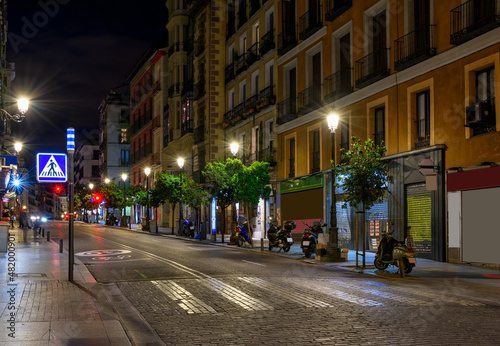 Calle Mayor is old street in Madrid, Spain. Architecture and landmark of Madrid. Night cityscape of Madrid.