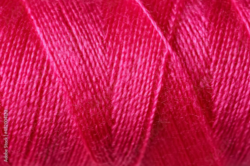 Pink sewing threads as background