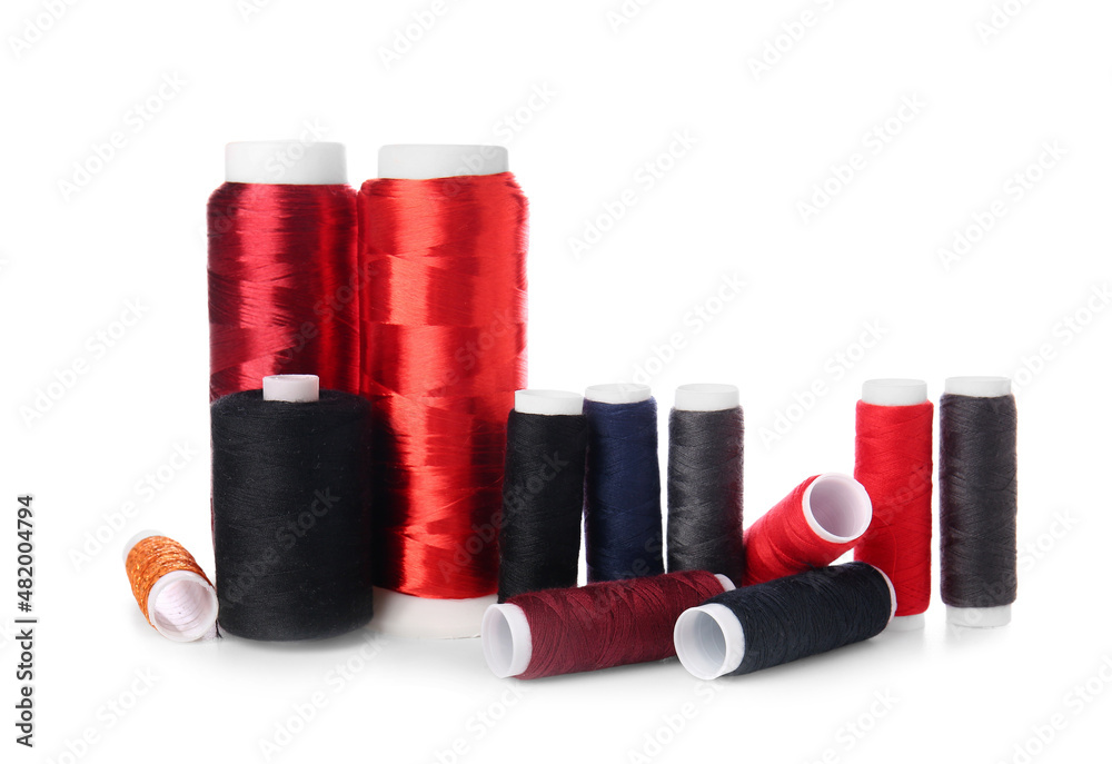 Different sewing thread spools on white background Different sewing thread spools on white background