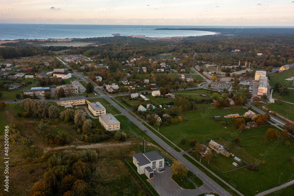 An aerial drone view of the industrial city in the Baltic. Plant for the production of concrete. Wind park. An aerial drone view of the industrial city in the Baltic. Plant for the production of concrete. Wind park.