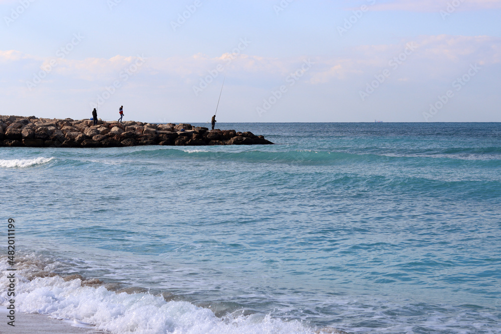 Empty beach photo. Beautiful coastline with calm seawater, sand.