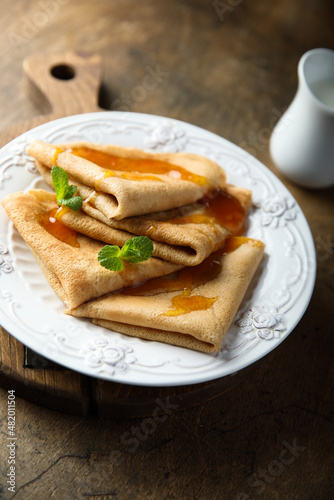 Homemade crepes with apricot jam