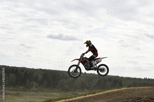 Fototapeta Naklejka Na Ścianę i Meble -  motocross rider in action, biker