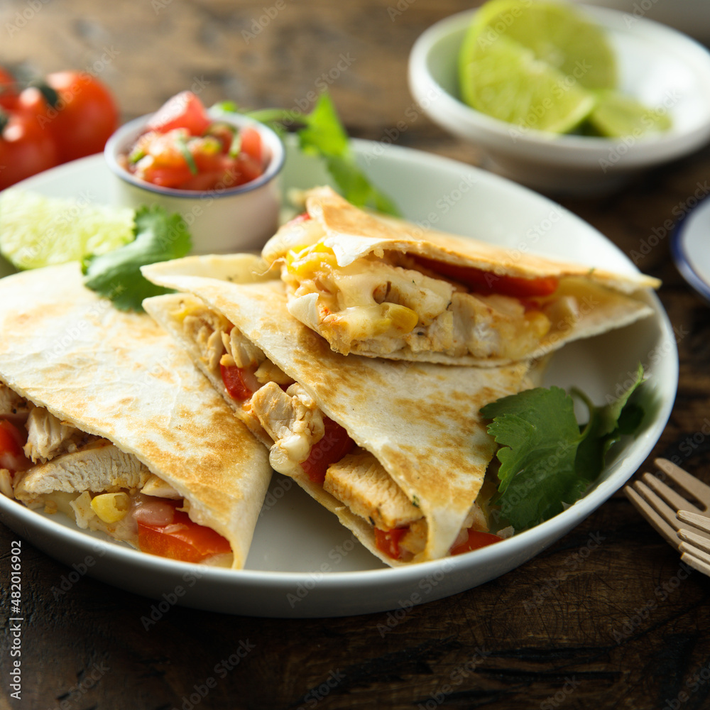 Homemade quesadilla with chicken and tomatoes Homemade quesadilla with chicken and tomatoes