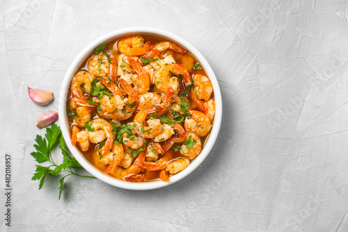 Traditional spanish shrimp with garlic and parsley photo