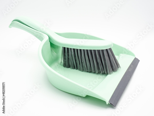 Small plastic dustpan and shovel on white background