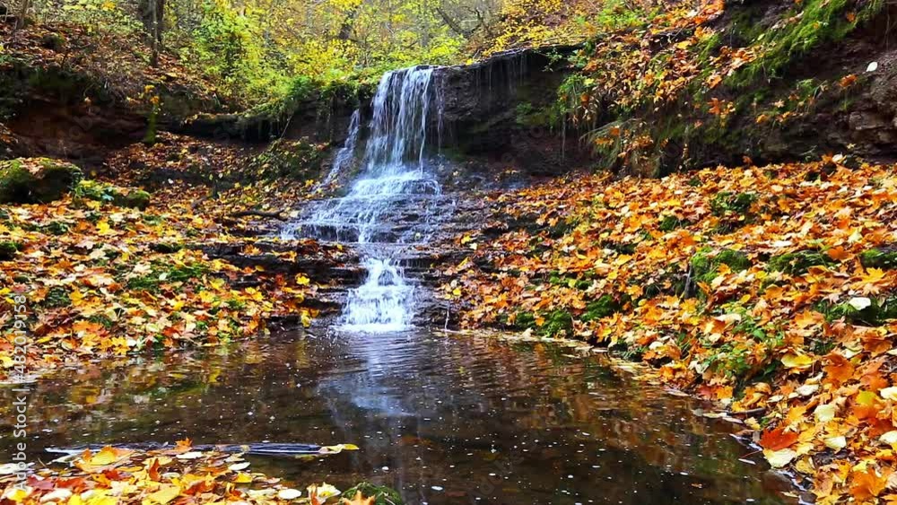Awesome view of the unique waterfall and yellow leaves. Awesome view of the unique waterfall and yellow leaves.