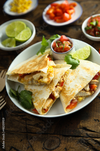 Homemade quesadilla with chicken and tomatoes