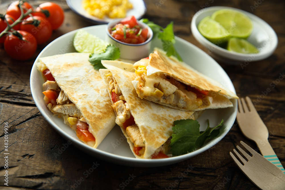 Homemade quesadilla with chicken and tomatoes