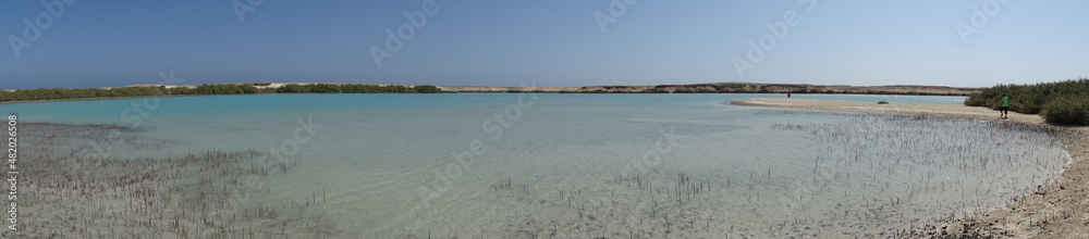 A panorama view of the sea with shallow water and turquoise color