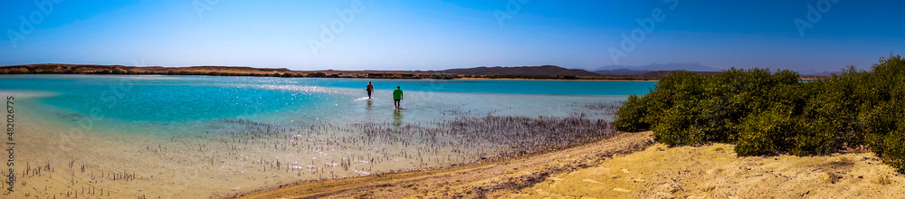 A panorama view of the sea with shallow water and turquoise color
