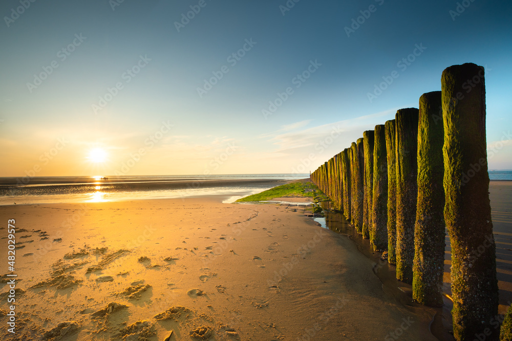Beautiful sunset at the westerschelde sea at the dutch coast in zeeland, Nieuwvliet.