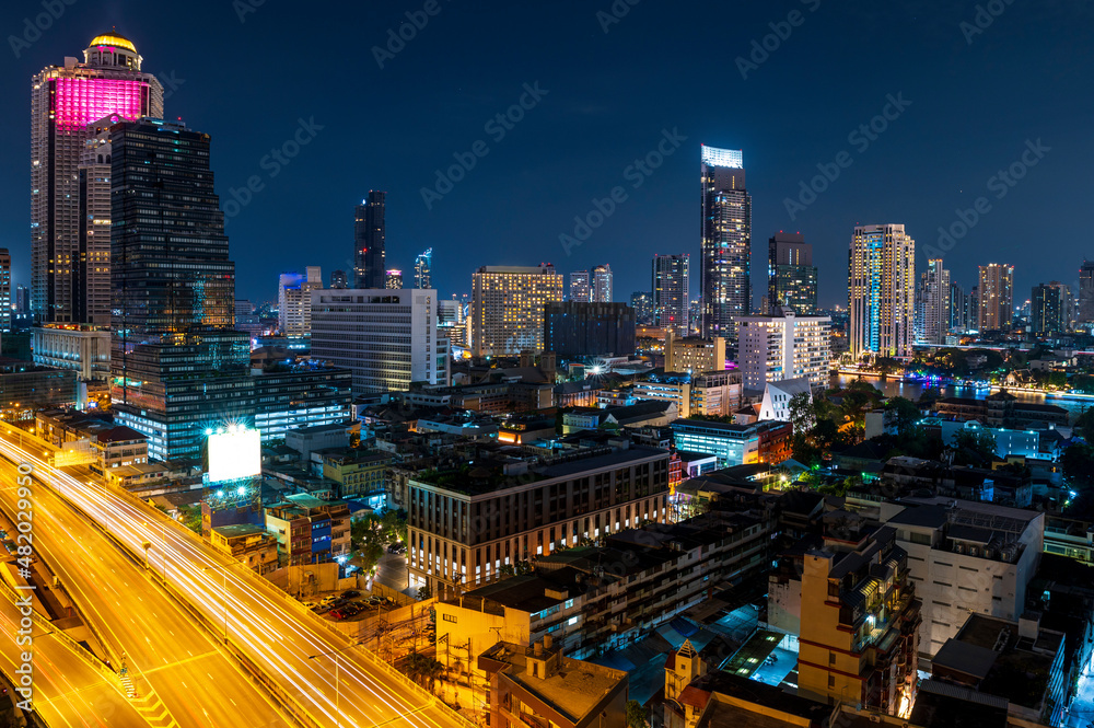 cityscape Bangkok skyline in Twilight night light view and traffic light on road , Bangkok city, Thailand.