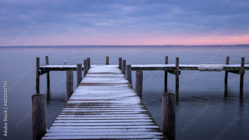 Sunset at the Steinhuder Meer. Jetty leads into the water