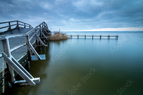 Bild auf Leinwand Sunset at the Steinhuder Meer. Jetty leads into the water