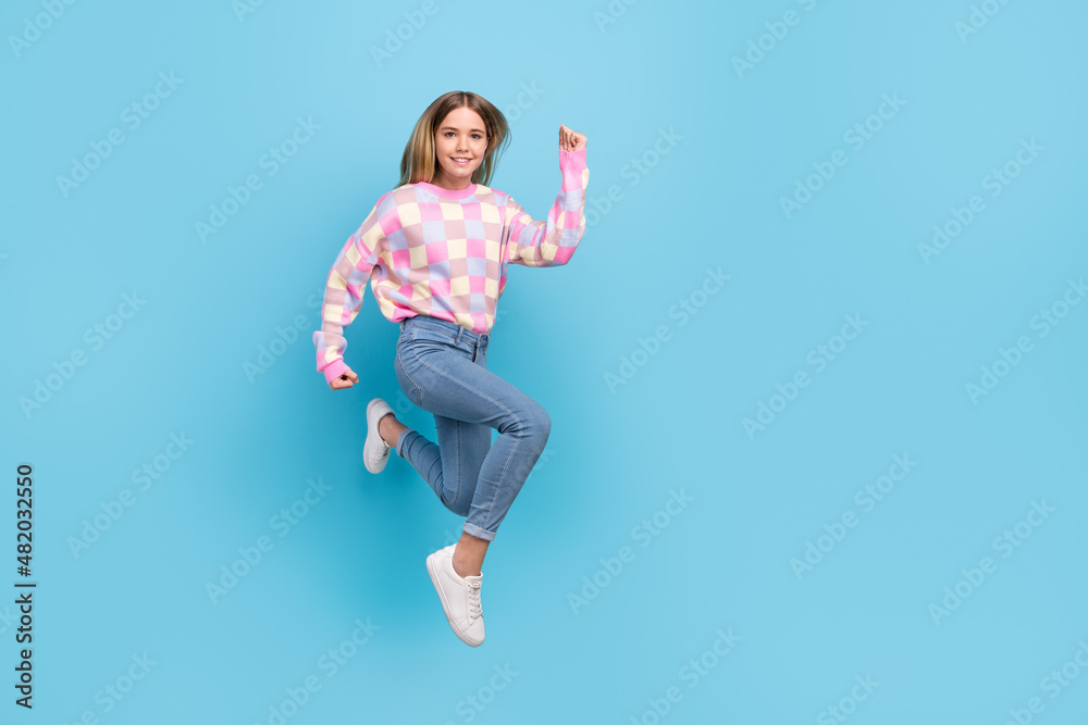 Full length body size view of attractive girly cheerful girl jumping running copy space isolated over bright blue color background