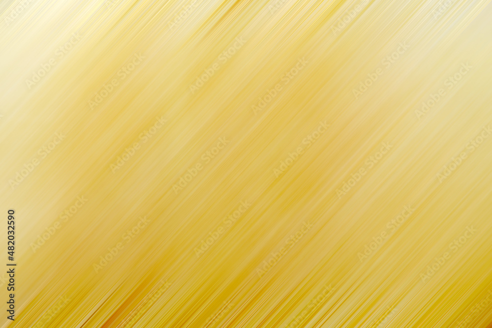Soft focus - abstract background, bright yellow sheets, patterned and textured waves motion,for making background. yellow bright background abstract with reflection.                                   