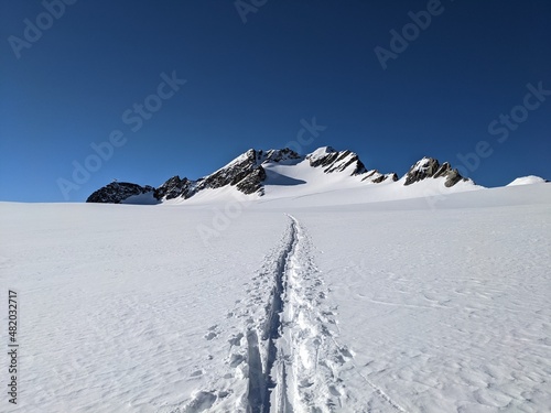 ski touring trail in the mountains. Alps in Europe, Switzerland. Ski mountaineering on the Clariden Glaurs, Glacier Firn photo
