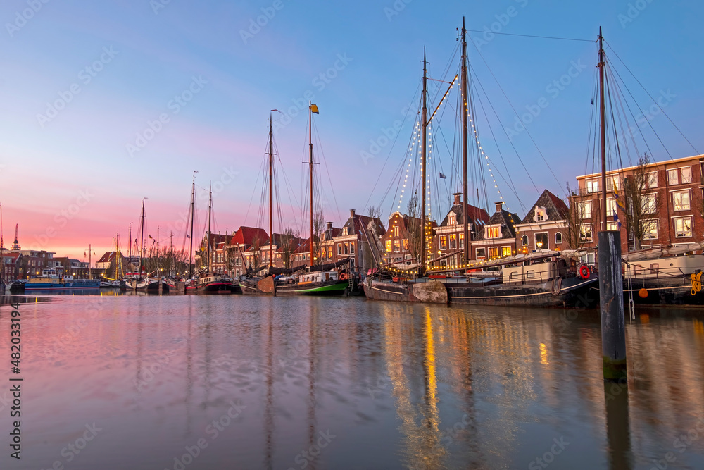 City scenic from the harbor in Harlingen in the Netherlands at sunset