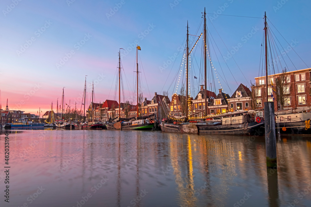 City scenic from the harbor in Harlingen in the Netherlands at sunset City scenic from the harbor in Harlingen in the Netherlands at sunset