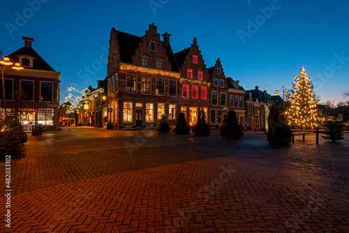 Historical city Dokkum in christmas time in the Netherlands at sunset