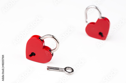 Red heart lock on the white...