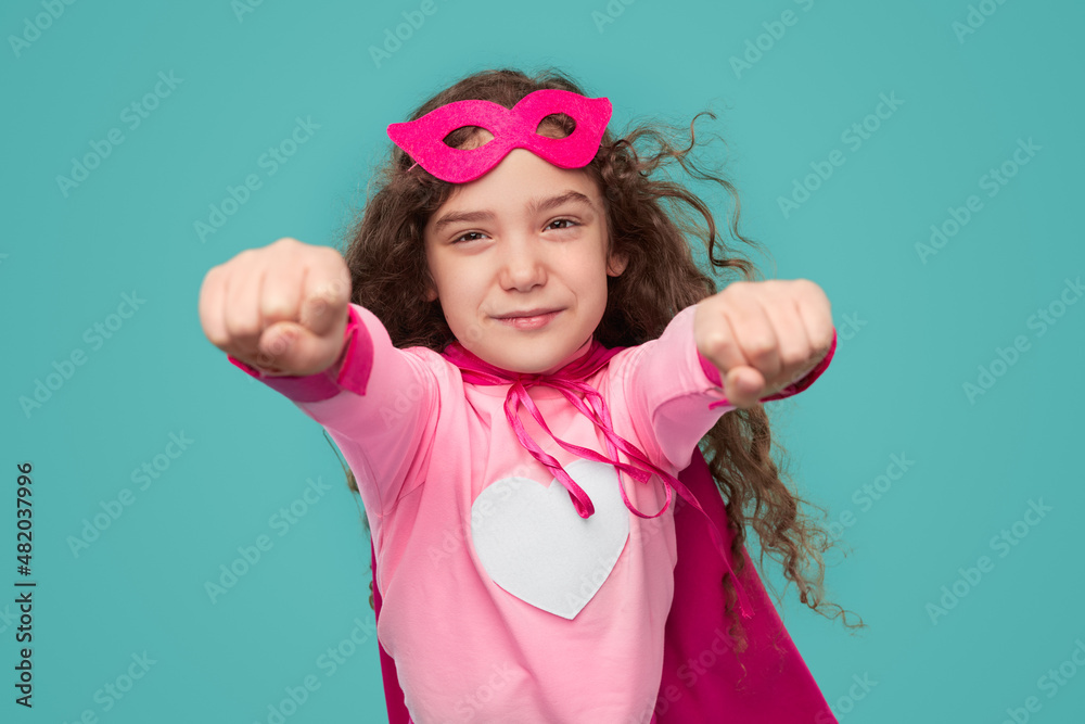 Brave superhero girl flying with outstretched arms Brave superhero girl flying with outstretched arms