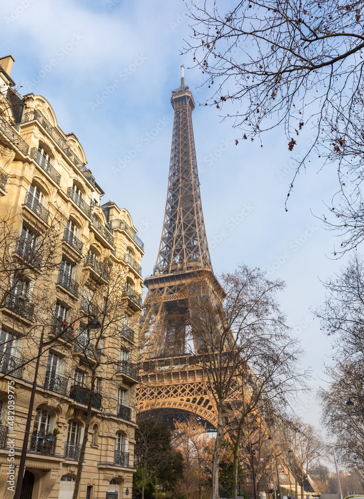 Eiffel Tower in Paris and typical residential buildings