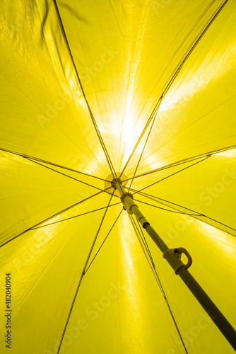Detail Of A Yellow Umbrella with Bright Sun