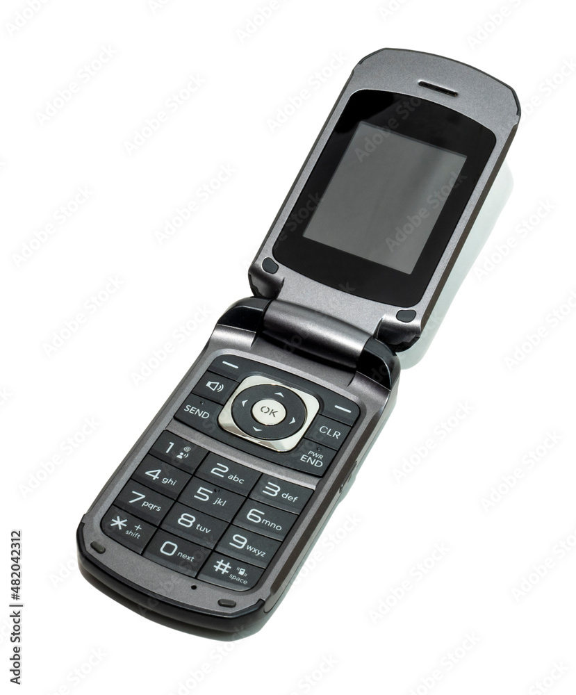 Black and gray cellular flip phone isolated on white with drop shadow. Black and gray cellular flip phone isolated on white with drop shadow.