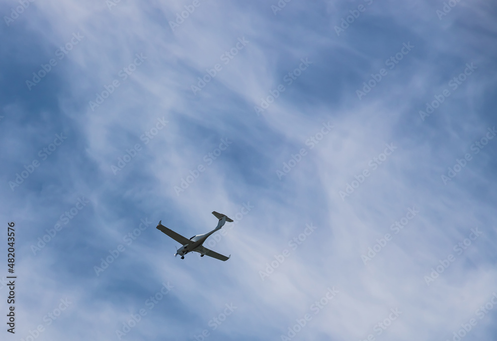 small plane flying low in the sky with space for text small plane flying low in the sky with space for text