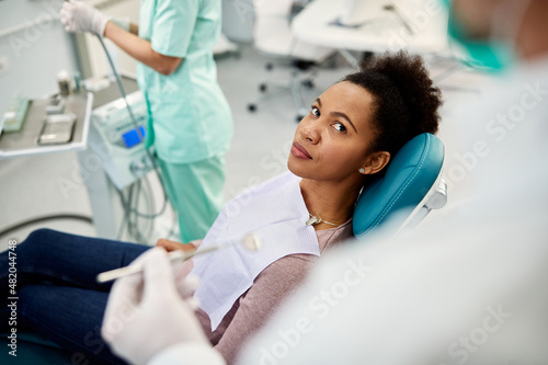 African American woman having dental appointment at dentist s.