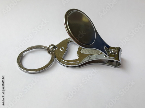 silver nail clipper on white background