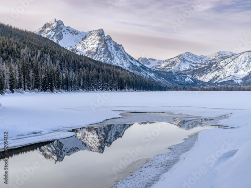 Frozen Stanley lake with a pool of water reflection