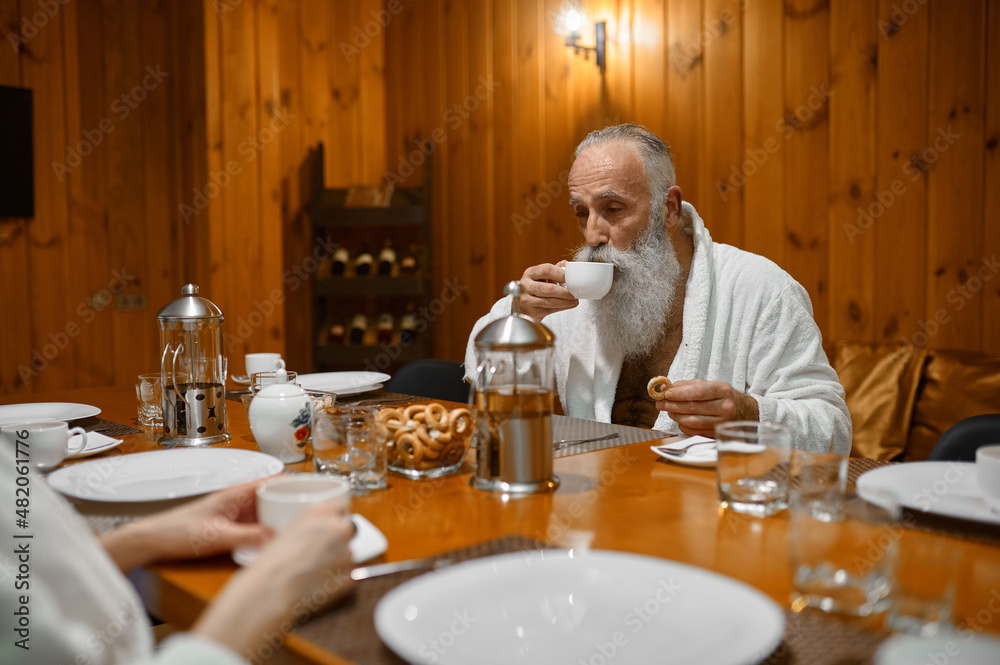 Senior man rest with friends in sauna Senior man rest with friends in sauna