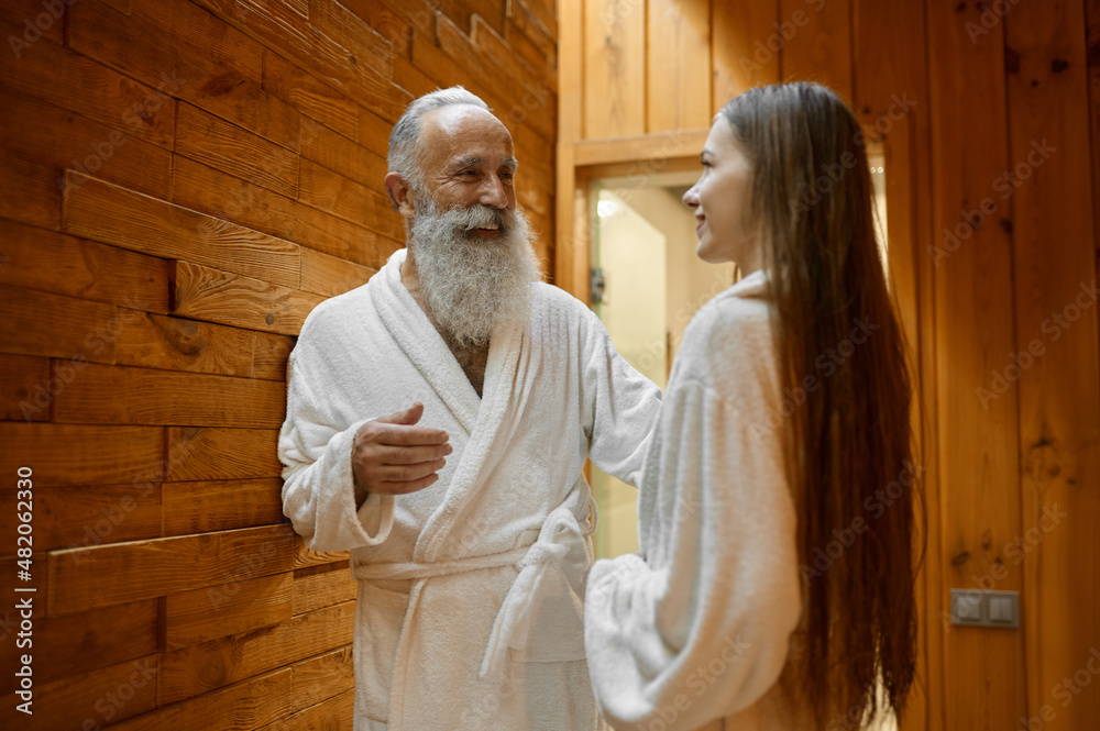 Man and woman talking in spa sauna