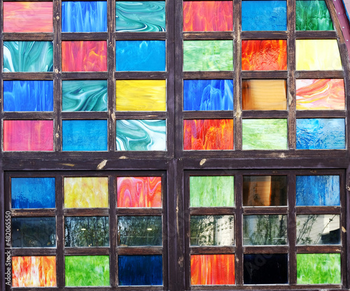 Stained glass multi-colored mosaic windows wall, texture background