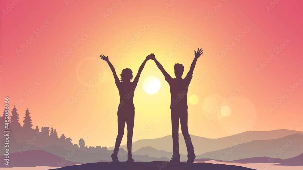 Silhouette of a couple of a woman and a man with raised hands on the background of nature and sunset