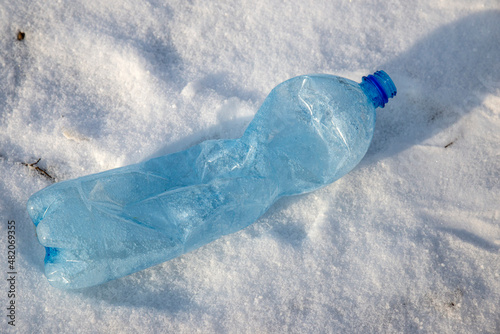 empty used plastic bottle as a symbol of environmental pollution