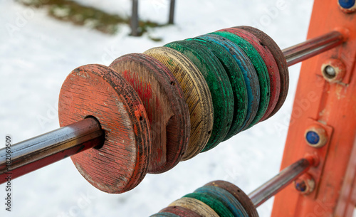 This is a wooden abacus on the outdoor playground