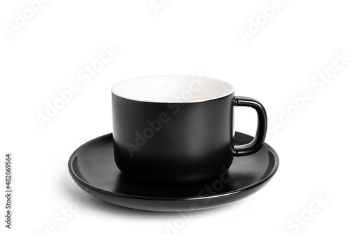 Black empty tea cup and saucer for drink isolated on white background. Ceramic coffee cup or mug close up.