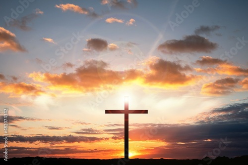 The cross of God in the rays of the sun. Fundamentals of religions