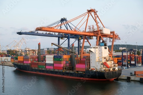 A big container ship during loading in the port