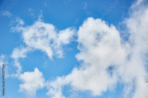 White fluffy clouds in a dark blue sky. Several clouds. Resources for matte painting.