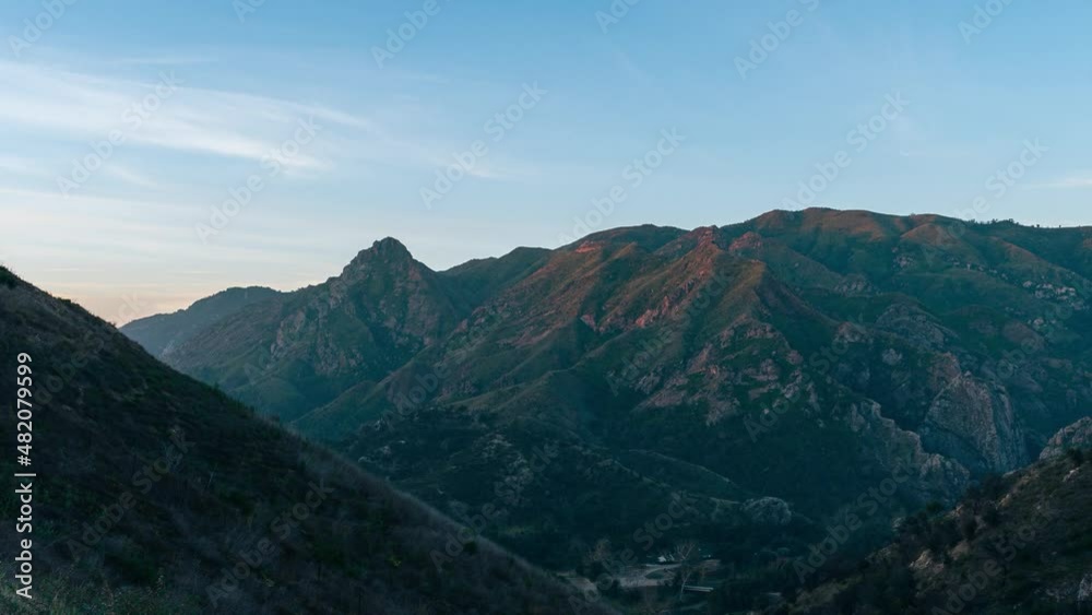time lapse view of sunrise over green Santa Monica Mountain Range at Malibu Creek State Park near Calabasas California time lapse view of sunrise over green Santa Monica Mountain Range at Malibu Creek State Park near Calabasas California