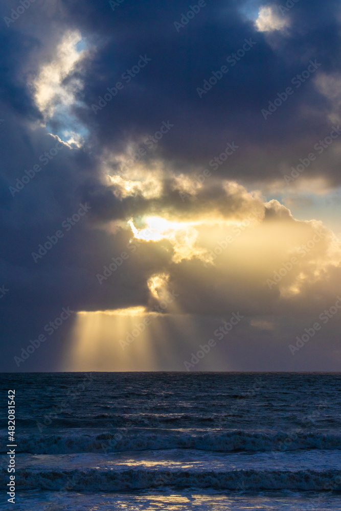 Evening clouds with sun rays