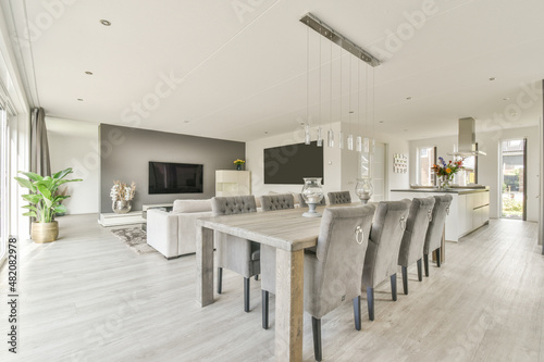 Dining table with chairs in open plan living room