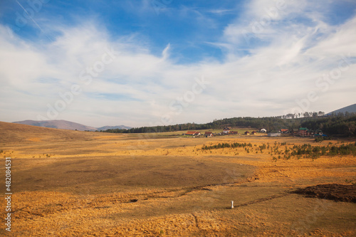 Beautiful nature landscape, autumn colors. View on hills and fields. Amazing nature of Serbia. Blue sky with clouds.