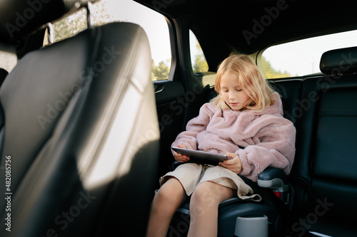 Girl sitting in car photo